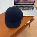 Dark blue quick-dry nylon five-panel camp hat on a minimalist wooden desktop background - 56-59cm (Adjustable) / Navy Blue