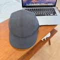 Dark grey quick-dry five-panel cap with short brim on a wooden desk with a laptop - 56-59cm (Adjustable) / Gray