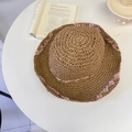 Tan woven straw sun hat with pink floral accents and green leaves for summer beach wear - 56-58cm Adjustable / Khaki