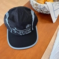 Black five-panel quick-dry hat with gray piping and sport typography in a cafe setting - 56-58cm Adjustable / Black