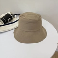 Khaki canvas bucket hat with reinforced stitching on a white table setting - 56-59cm / Khaki