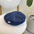Dark blue denim beret with white contrast stitching and a silver triangular metal detail - 55-59CM / Dark Blue