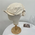 Beige retro cotton linen newsboy cap with metal chain detail on mannequin head - 56-59cm / Beige