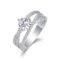 Close-up of a S925 silver ring with a large round diamond and multilayered crossover bands - US Size 7 / 1ct Moissanite