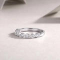 Detail of S925 silver ring featuring moissanite stones and twisted infinity band design - US Size 5 / Twisted Band Entwined Ring (R13581)