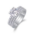 Macro shot of three-piece S925 silver moissanite bridal set with round-cut center stone - US Size 9 / R13772 Moissanite 2 Carat