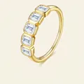 Golden S925 silver ring featuring five emerald-cut moissanite stones in a row - Emerald Cut 5-Stone Style