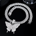 Close-up of iced out cuban link chain and butterfly pendant with sparkling rhinestones - Silver Butterfly Choker Necklace
