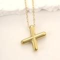 Macro detail of glossy gold-plated chubby X letter pendant on minimalist thin link chain - Gold Letter X