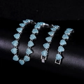 Sparkling silver heart-shaped link necklace with blue crystals on black background - Silver Blue