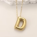 Golden puffy letter D necklace with radiant grooves and balloon style pendant - Gold Letter D