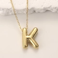 Polished gold-plated puffed letter K pendant necklace with smooth metallic finish - Gold Letter K