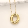 Golden oval pendant necklace with radial texture and polished finish on cross chain - Gold Letter O