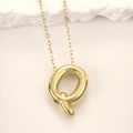 Polished gold chubby letter Q pendant necklace in stainless steel with a chunky design - Gold Letter Q