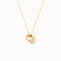 Macro shot of interlocking dual-circle pendant with pavé crystals on a fine gold chain - 925 Silver / Gold
