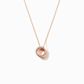 Close-up of interlocking rose gold rings necklace with one circle set in pavé zircon stones - 925 Silver / Rose Gold