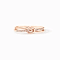 Macro view of rose gold double knotted ring with pave white crystal stones - US Size 5 / Rose Gold