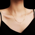 Elegant 18K gold plated titanium steel satellite chain necklace worn on a model - Necklace / Rose Gold