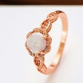 Elegant S925 rose gold opal flower ring featuring a circular opal with sparkling halo - Rose Gold