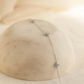 Minimalist s925 silver flower bracelet with blue opal stones on marble display - 925 Silver / White Gold