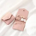 Pink suede portable jewelry pouch showing interior snap button and pearl storage slots - Pink (Velvet)