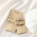 Detail of beige velvet jewelry pouch showing snap closure for earrings and rings - Apricot (Velvet)