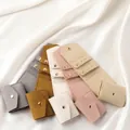 Micro-velvet jewelry pouches in five colors with gold snap buttons on white silk background - Caramel (Velvet)