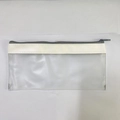 Detail view of the clear PVC pencil case with a gray zipper and white synthetic leather trim - White