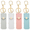 Detailed view of four colorful PU leather lipstick holders with gold rivets and keychains - Multicolor Style 2