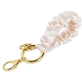 Detail of satin scrunchie keychain with champagne fabric and gold metal lobster clasp - Apricot Wristlet