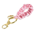 Detail of pink satin pleated wristband keychain with gold alloy spring clasp and rings - Pink Wristlet