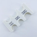 Macro detail of compact white coin organizer with 6 slots for Japanese Yen denominations - White Coin Rack (CW-157)