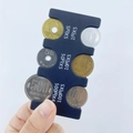 Detail of blue plastic Japanese coin holder showing slots for 500 to 1 yen coins - Black Coin Rack (CW-157)