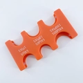 Detailed view of orange plastic Japanese coin organizer showing six slots for JPY currency - Orange Coin Rack (CW-157)