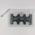 Detailed view of portable PVC coin purse with internal sorter slots for currency storage - Black Bag Set