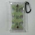Detail view of portable Japanese coin organizer with PVC pouch and metal carabiner clip - Light Green