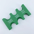 Detail view of green plastic Japanese coin organizer with six functional sorting slots - Green Coin Rack (CW-157)