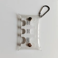Detail view of transparent PVC coin holder with internal slots for Japanese Yen denominations - White