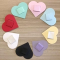 Eight colors of heart-shaped PU leather pen holders with elastic loops on wood background - Multicolor Set