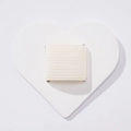 Macro detail of white heart-shaped PU leather pen holder with elastic loop for notebooks - White