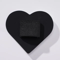 Detail of black elastic pen holder loop with adhesive heart-shaped PU leather base - Black