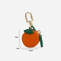 Mini orange shaped PU leather coin purse with green leaf detail and gold hook, 4x3.5x2cm - Small Orange