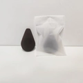 Detailed macro view of dark brown teardrop beauty blender with frosted storage bag - Devil Egg Style