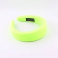 Detailed shot of fluorescent sponge headband showing the handmade label and fabric texture - Fluorescent Green