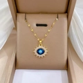 Detailed view of luxury gold-plated evil eye pendant with sparkling crystal halo inlay - Sunflower Star Style