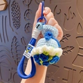 Handmade crochet light blue lucky bag keychain with bell and long woven lanyard strap - Blue Rose (Dress Style)