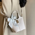 Chic beige lychee leather bucket bag with silk scarf accent and elegant gold clasp lock - Off-White With Silk Scarf