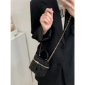 Chic black quilted leather mini vanity case with gold chain strap worn cross-body - Black / Small