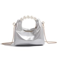 Detail of silver metallic dumpling bag featuring pearl top handle and gold chain strap - Silver