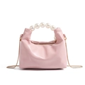 Pink dumpling handbag with pearl handle and golden chain, elegant minimalist style - Pink